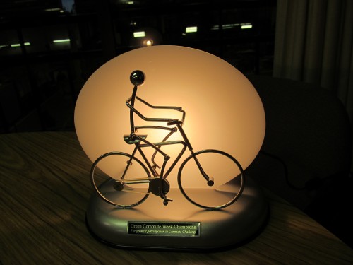 The Green Commute Week Trophy is a moving  bicyclist that is powered by solar energy.